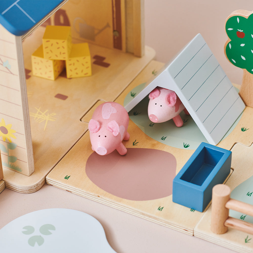 Wooden toy pigs