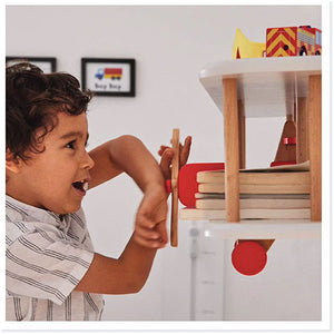 Child playing with a bi-plane wall shelf