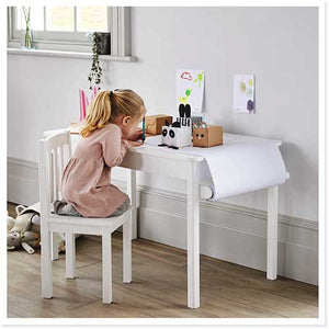Child crafting with growing activity table