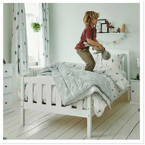 Child playing on a bed