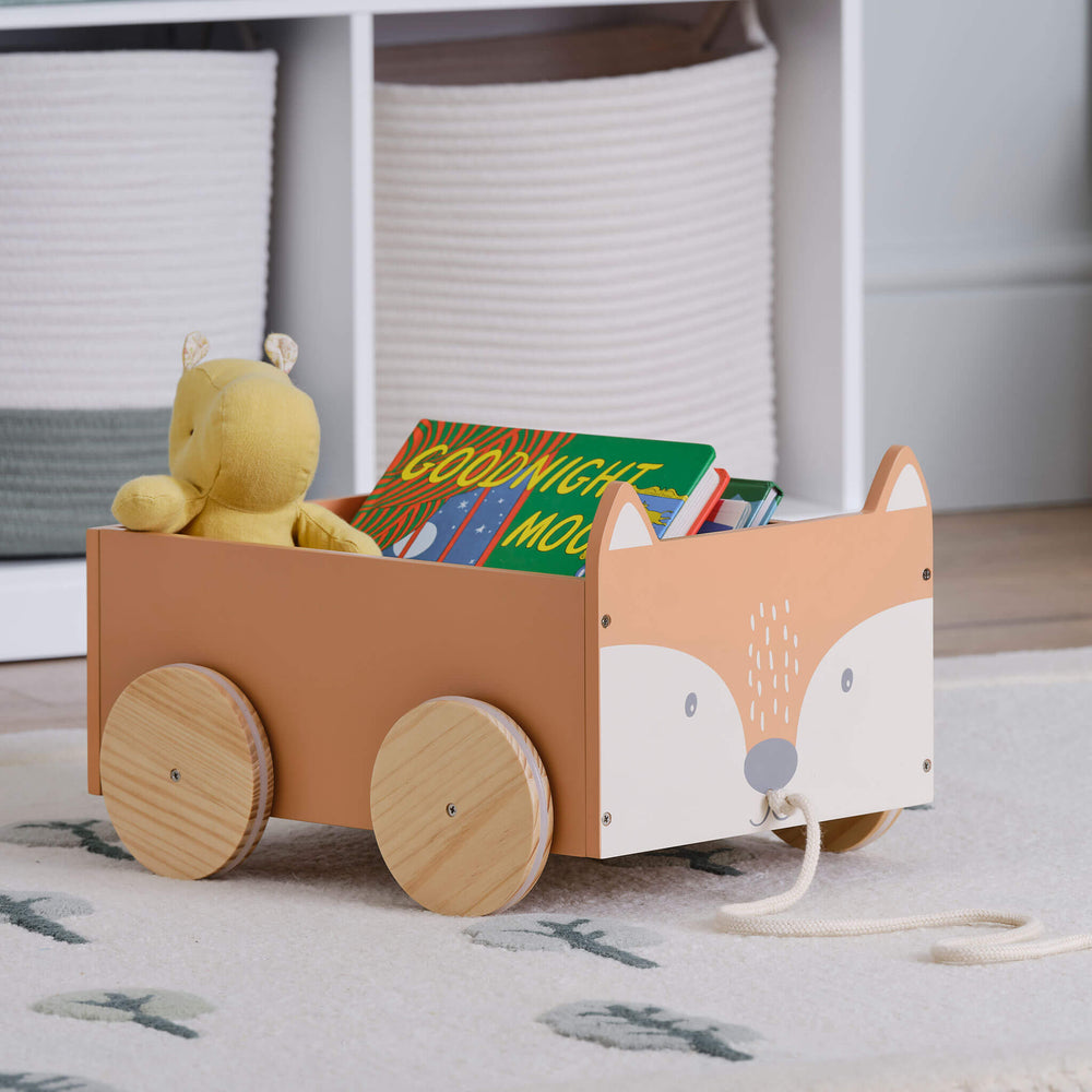 Wooden toy cart shaped like a fox with wheels on a light beige background