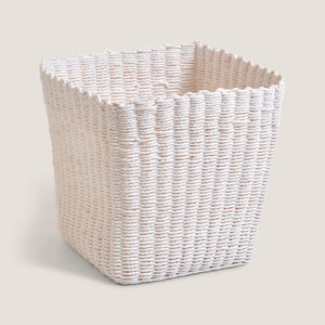 White woven rectangular basket on a light beige background