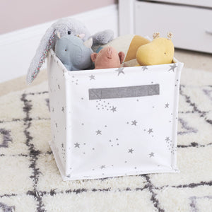 Canvas storage cube with white scattered stars design with toys inside	