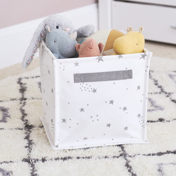 Canvas storage cube with white scattered stars design with toys inside	