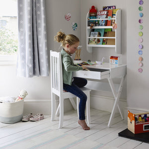 Greenaway mini bookcase in white and grey star curtains.	