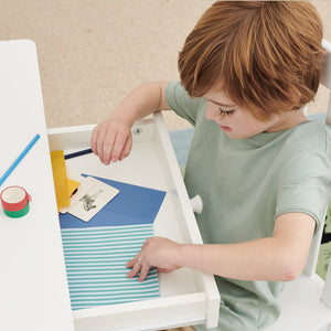 child opening drawer of tall whittington desk	