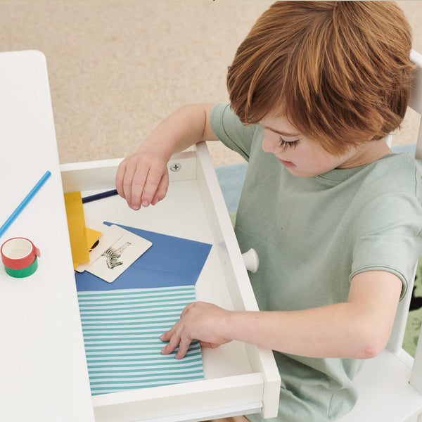child opening drawer of tall whittington desk	