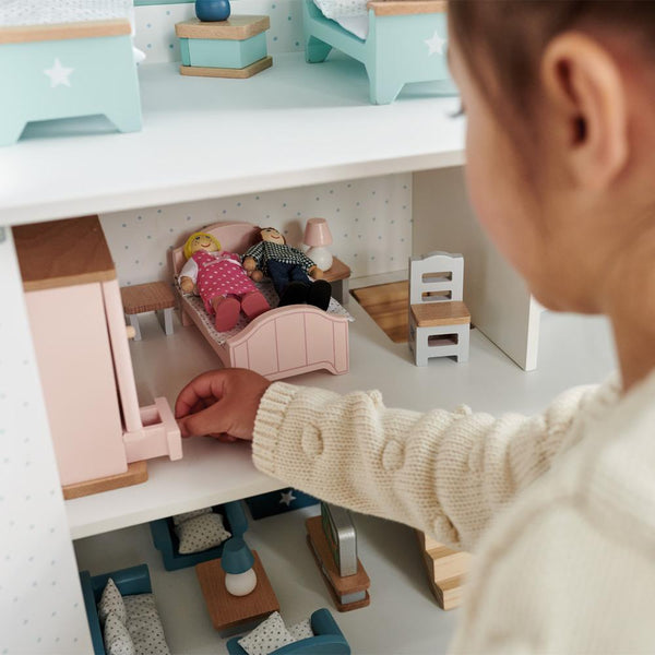 Wooden toy bedroom furniture and dolls