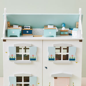 Childrens bedroom furniture in a dolls house
