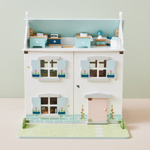 Childrens dolls house with bedroom furniture