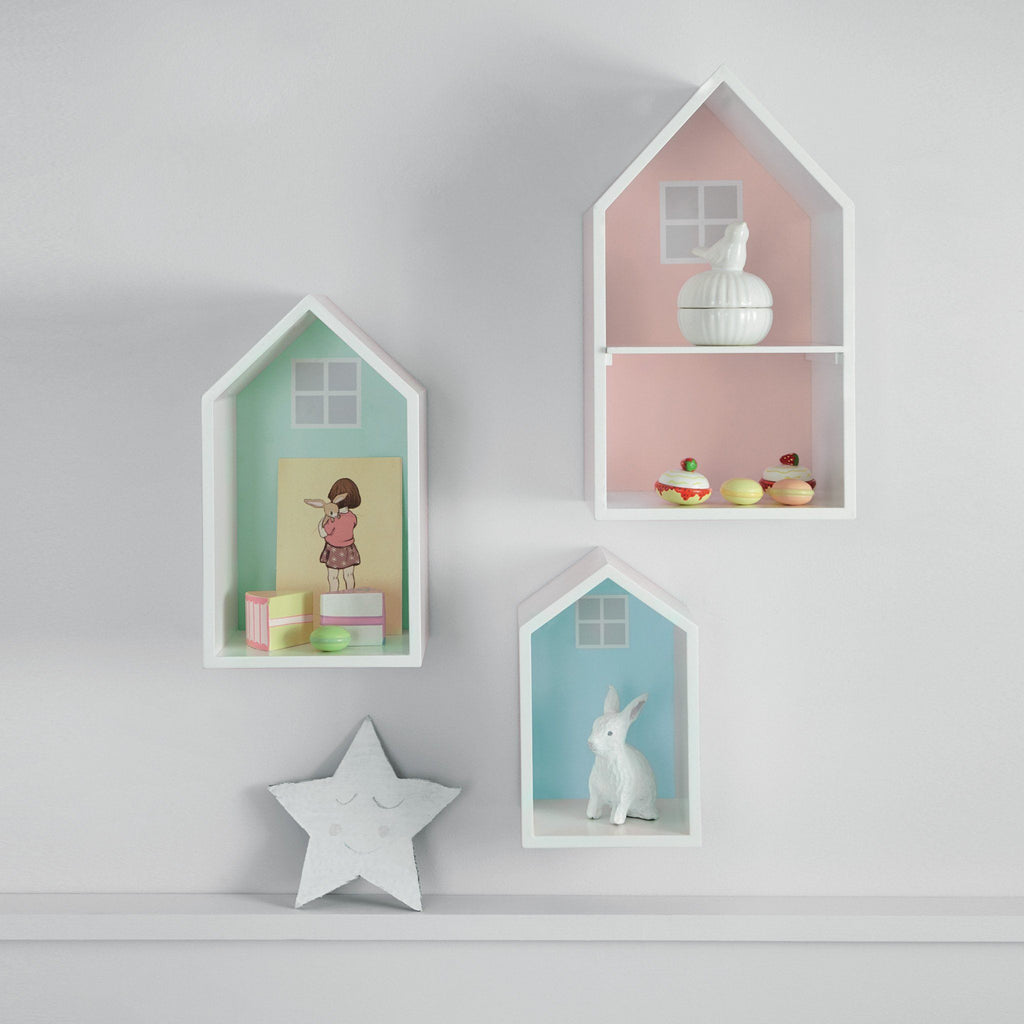 Pastel coloured wooden wall shelves and a star