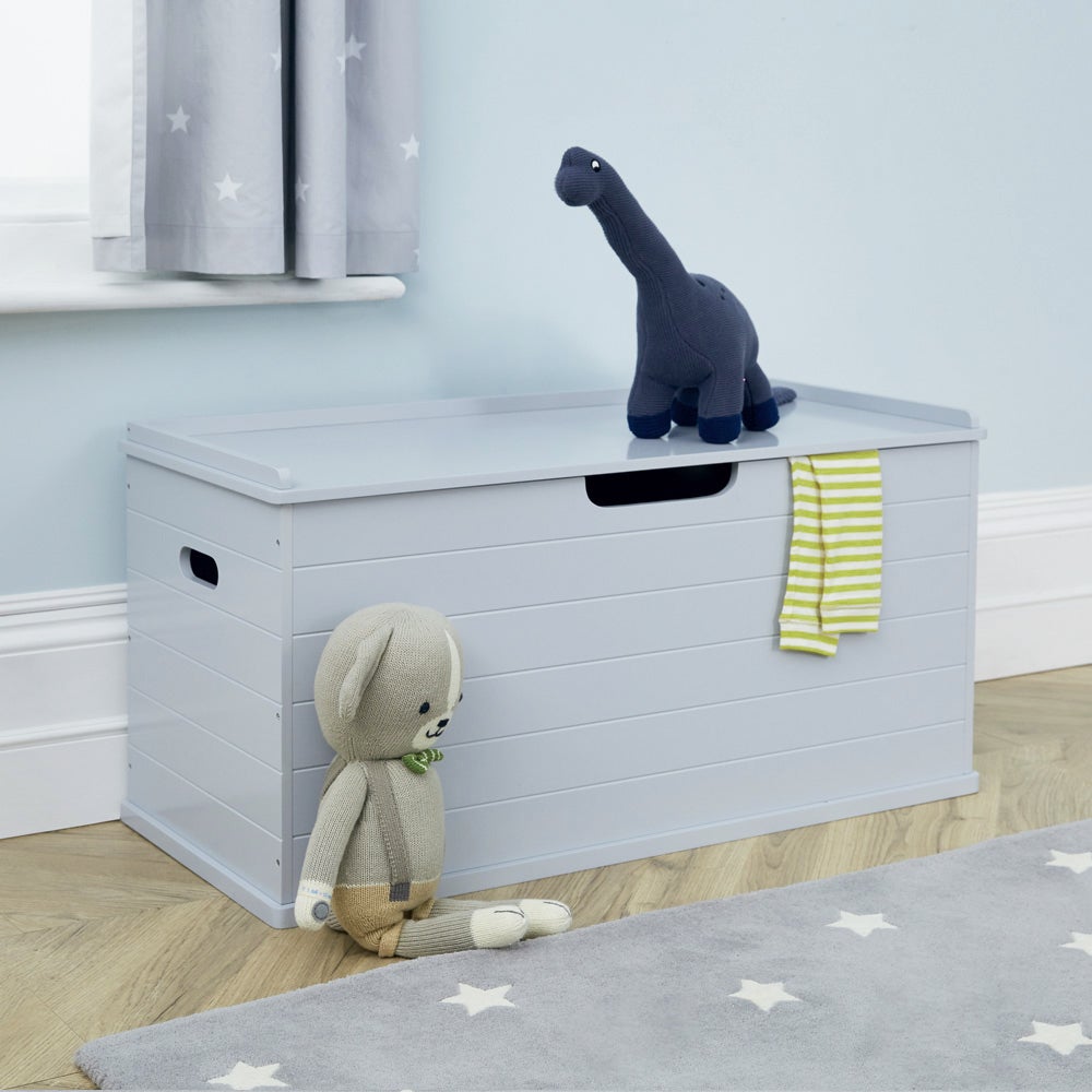 Grey large classic toy box in a room with toys