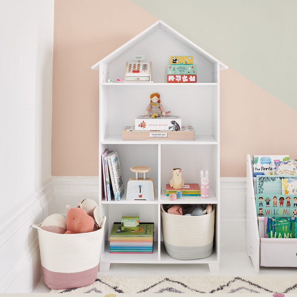 wooden bookcase with toys and books