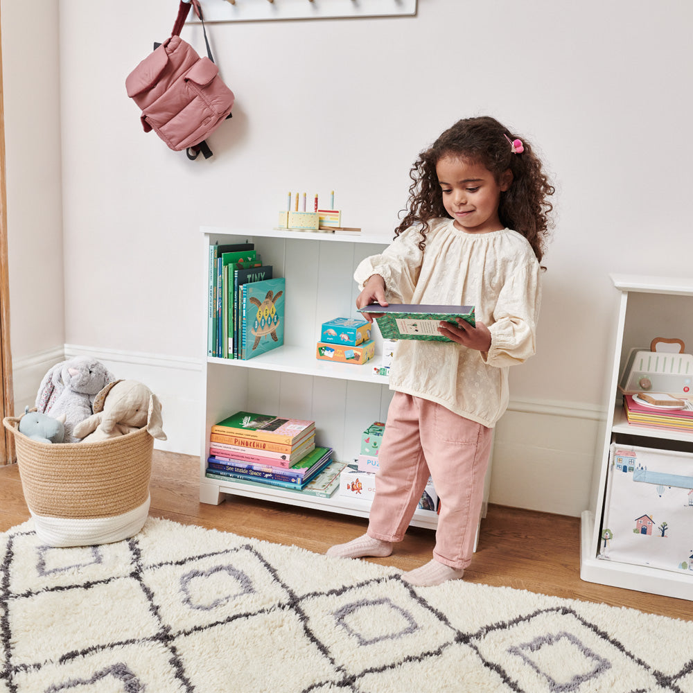 Crompton low bookcase with little girl reading